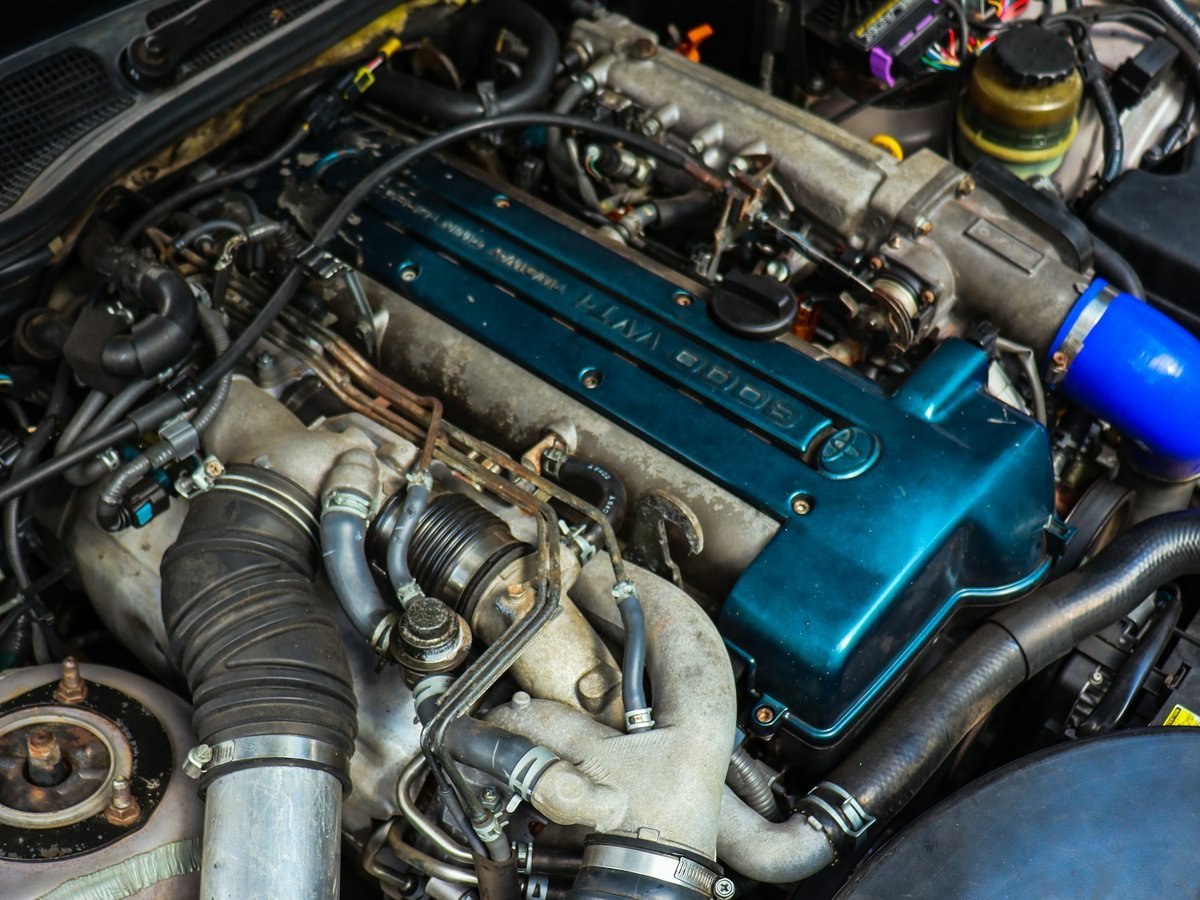JDM Toyota 16-valve twin-cam engine with a teal cam cover